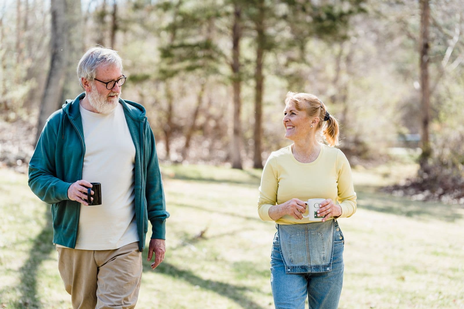 An older couple talking during a walk outdoors
